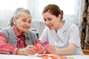 Senior woman with her elder care nurse