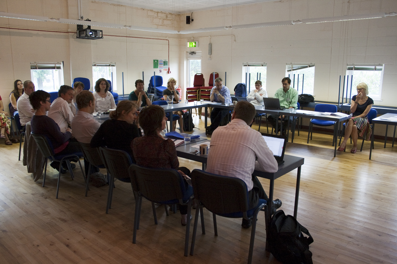 Generic Team meeting photo, 20 people sitting around a table