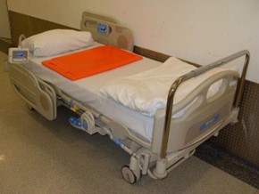 Image of an empty hospital bed